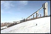 skiing next to ski jump at COP.  
The city of Calgary is in the distance. 
Photo taken about 1995 (110 kb).