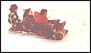 riding a toboggan 
in Calgary's Edworthy 
park about 1976, small 
enlargement (23 kb).