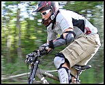 This biker flies 
by on his way 
 down the hill.  
Photo taken 2008 (235 kb).